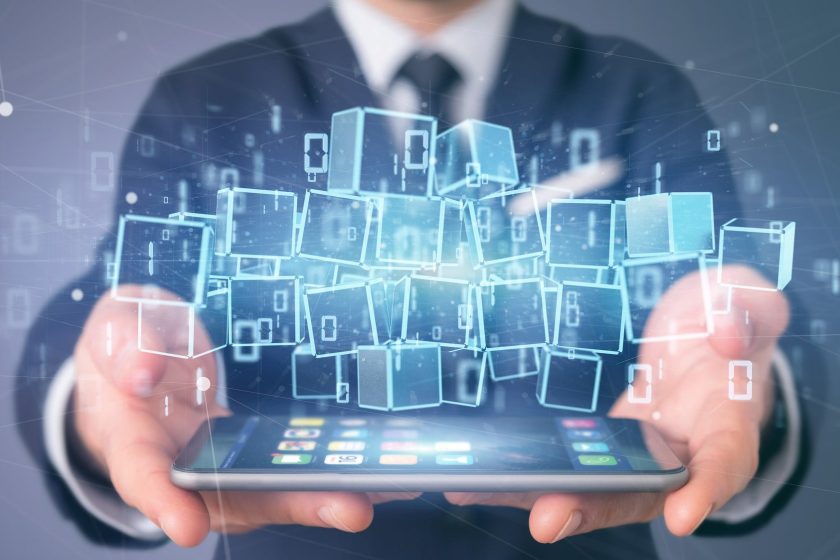 Businessman holding a Cloud of blockchain cube and binary data 3d rendering