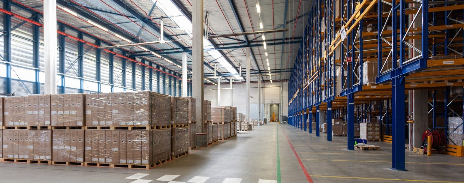 View of full warehouse with forklift