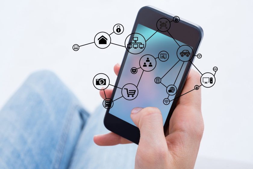 digital composite of hand holding smartphone with vignettes