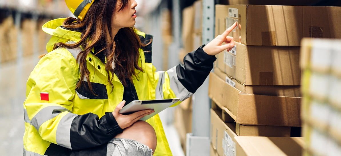 Portrait asian engineer woman shipping order detail on tablet ch